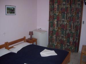 Postel nebo postele na pokoji v ubytování Hotel Elytis