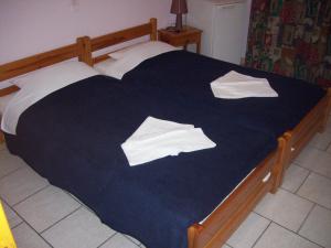 Postel nebo postele na pokoji v ubytování Hotel Elytis