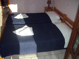 Postel nebo postele na pokoji v ubytování Hotel Elytis