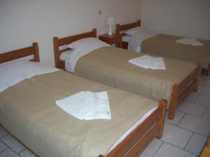 Postel nebo postele na pokoji v ubytování Hotel Elytis