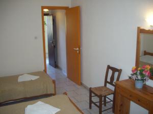 Postel nebo postele na pokoji v ubytování Hotel Elytis