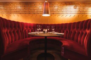 a table in a restaurant with wine glasses on it at Hotel Rival in Stockholm
