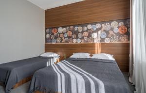 Postel nebo postele na pokoji v ubytování Hotel History • სასტუმრო ისტორია