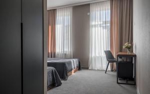 Postel nebo postele na pokoji v ubytování Hotel History • სასტუმრო ისტორია