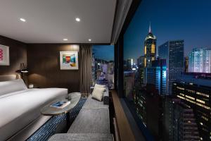 Ліжко або ліжка в номері The Hari Hong Kong
