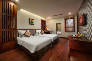 Voodi või voodid majutusasutuse Midori Boutique Hotel toas