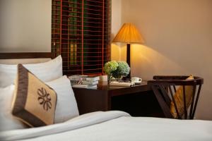 Voodi või voodid majutusasutuse Midori Boutique Hotel toas