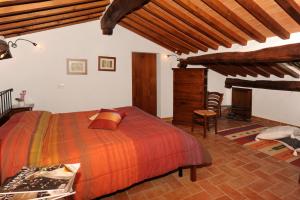 Postel nebo postele na pokoji v ubytování Agriturismo Poggio Tobruk