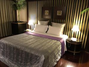 Letto o letti in una camera di Love Tree Motel