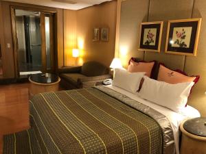 Letto o letti in una camera di Love Tree Motel