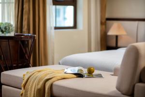 Voodi või voodid majutusasutuse Midori Boutique Hotel toas
