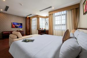 Voodi või voodid majutusasutuse Midori Boutique Hotel toas