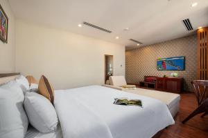 Voodi või voodid majutusasutuse Midori Boutique Hotel toas