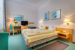 Säng eller sängar i ett rum på Hotel Alte Klavierfabrik Meißen