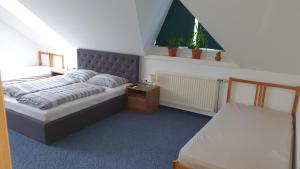 Postel nebo postele na pokoji v ubytování Veszprém Room