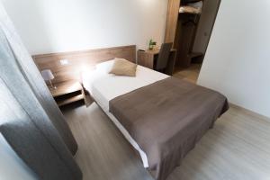 Postel nebo postele na pokoji v ubytování Claudio Rooms