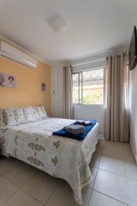 Postel nebo postele na pokoji v ubytování Suítes Balneário Camboriú