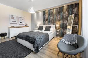Posteľ alebo postele v izbe v ubytovaní VIP Apartamenty Centrum Przy Równi