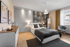 Posteľ alebo postele v izbe v ubytovaní VIP Apartamenty Centrum Przy Równi