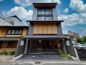a building with a tall tower on top of it at Connect inn Shichijo-Kawaramachi in Kyoto +37 photos
