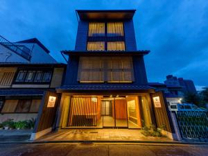 a building with a tower on top of it at Connect inn Shichijo-Kawaramachi in Kyoto