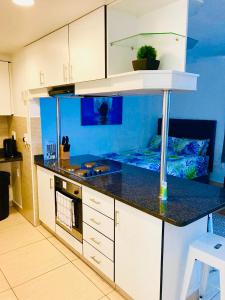 Кухня или мини-кухня в 206 Tenbury Beach Apartment
