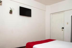 Postel nebo postele na pokoji v ubytování Hotel Allende 104