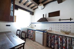 a kitchen with a sink and a counter top at Villa Lucia - Homelike Villas in Camporotondo di Fiastrone