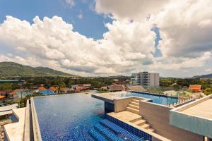 a view of a swimming pool on a building at Cozy design studio near Nai Harn beach in Nai Harn Beach