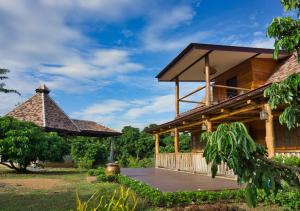 a house with a porch and a gazebo at Cozycomo Chiang Dao - Pha Mok in Amphoe Chiang Dao +24 photos