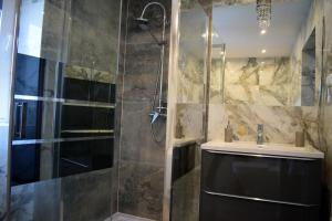 a bathroom with a shower and a sink at Sepia Restauracja & Noclegi in Jasło