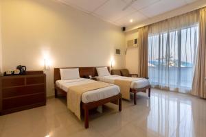 Una cama o camas en una habitación de Grand Hotel Mumbai - Ballard Estate, Fort