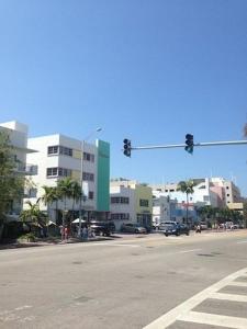 an intersection with a traffic light on a city street at Collins Avenue Hostel in Miami Beach