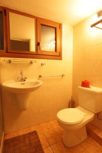 a bathroom with a toilet and a sink at Nicosia Luxury Studio in Nicosia