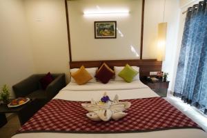 Ein Bett oder Betten in einem Zimmer der Unterkunft Silicon Inn Hotel Bangalore Airport