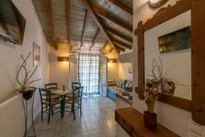 a kitchen and dining room with a table and chairs at Villa Yannis in Kato Korakiana