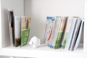 a shelf with a bunch of books on it at Alla Corte del Conte in Conversano