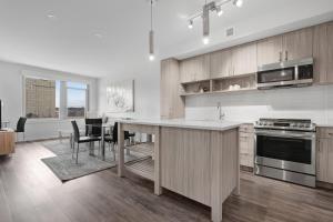 a kitchen with a counter and a table with chairs at Global Luxury Suites Crystal City in Arlington