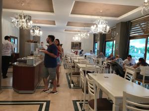 a group of people standing in a restaurant at My Dream Hotel in Marmaris