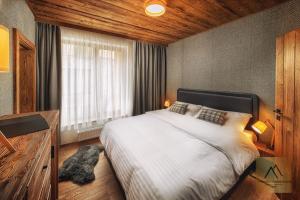 Tempat tidur dalam kamar di Apartment Claudie de Luxe