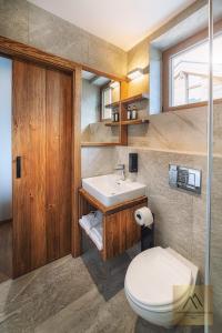 a bathroom with a sink and a toilet at Apartment Claudie de Luxe in Demanovska Dolina