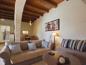 a living room with a couch and a table at Villa Argiro Plaka Crete in Plaka