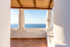 a room with a view of the ocean at LE CASETTE DI MALFA in Malfa