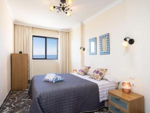 A bed or beds in a room at Apartment Buenavista by Interhome