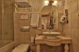 a bathroom with a sink and a toilet and a mirror at Yusuf Yigitoglu Konagi - Special Category in Urgup +102 photos