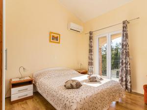 a bedroom with a bed and a window at Holiday Home Lara by Interhome in Vrsar