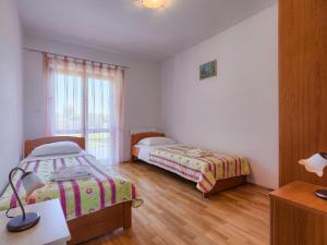 Postel nebo postele na pokoji v ubytování Holiday Home Gracije by Interhome