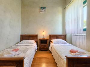 Postel nebo postele na pokoji v ubytování Holiday Home Gracije by Interhome