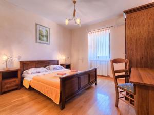 Postel nebo postele na pokoji v ubytování Holiday Home Gracije by Interhome
