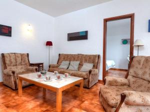 a living room with a table and two chairs at Apartment Sant Carles by Interhome in Llança